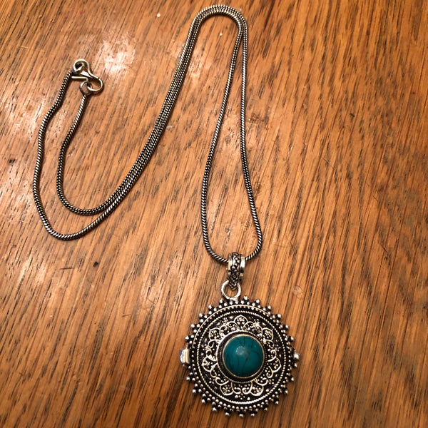 Sterling silver starburst and turquoise round locket necklace